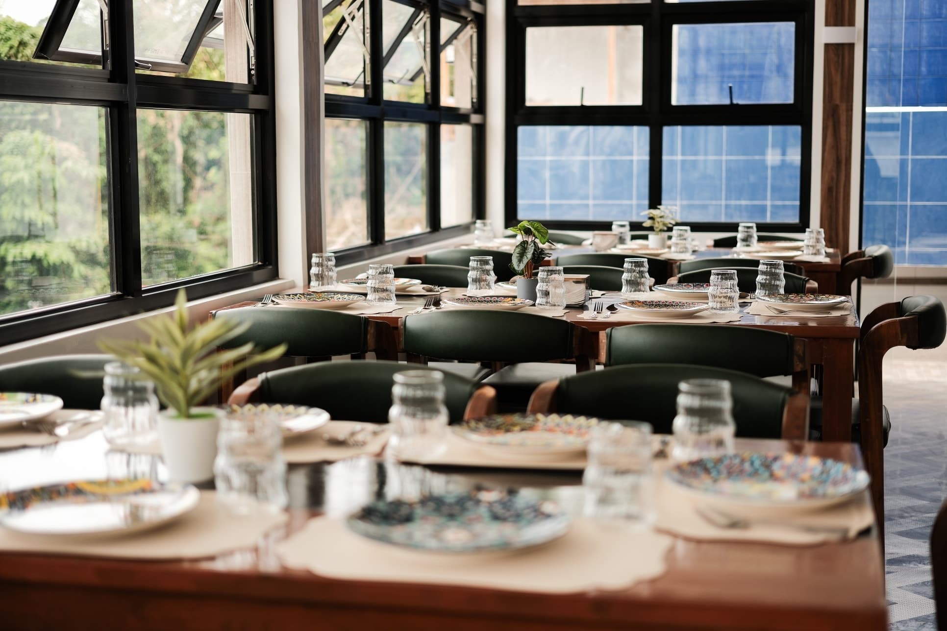 Beautifully staged dining room interior at Merry Plates Restaurant with mountain views through the windows