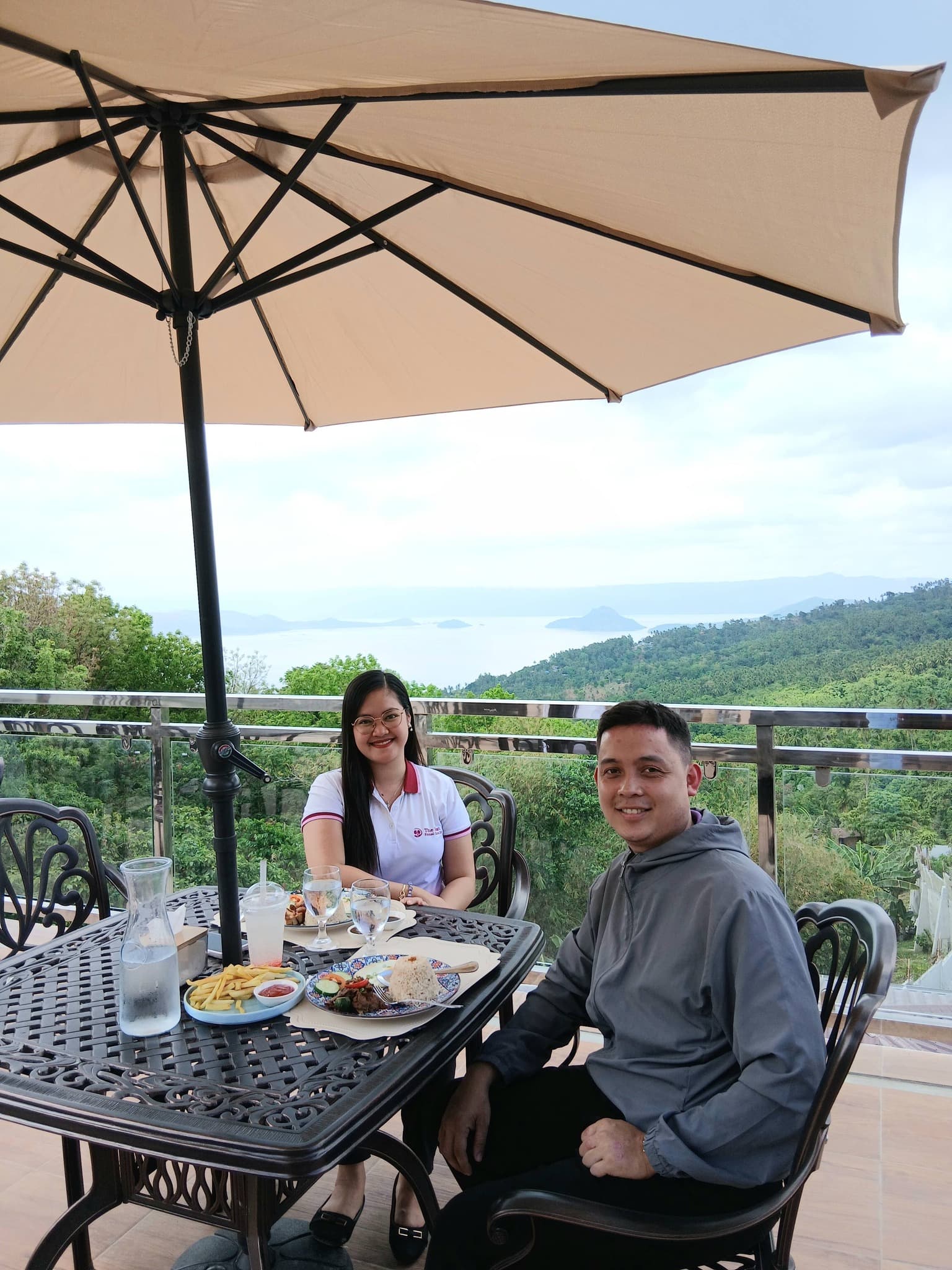 Couple on the terrace at Highlights Taal Lakeview Resort Batangas with sweeping mountain valley views